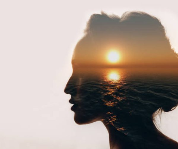 Psychology concept. Sunrise and woman silhouette.